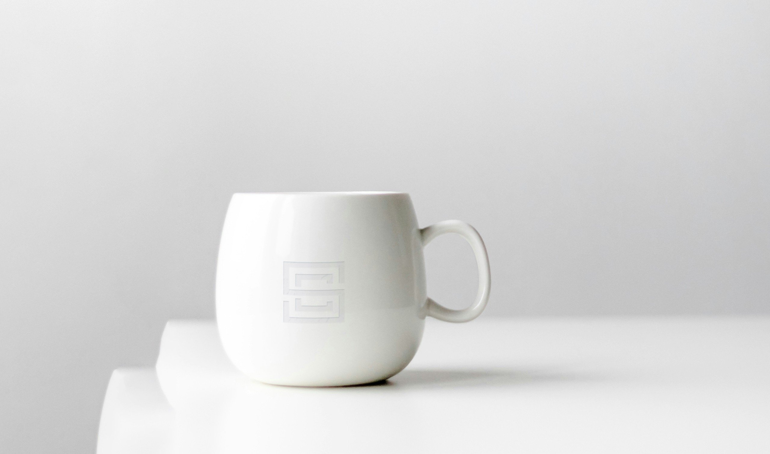 Cro Sea Villas brand identity β minimalist mug and product design mockup